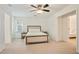 Bright bedroom features neutral carpeting and a queen size bed with two side tables at 4086 Norton Se Pl, Smyrna, GA 30082