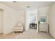 Bright room showing a cushioned chair, window, desk and dresser with simple decor at 4086 Norton Se Pl, Smyrna, GA 30082