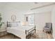 Cozy bedroom with a large bed, neutral decor, and natural light at 4086 Norton Se Pl, Smyrna, GA 30082