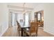 Bright dining room featuring a wooden table with seating, complemented by modern lighting and elegant décor at 4086 Norton Se Pl, Smyrna, GA 30082