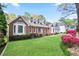 Beautiful home showcasing lush landscaping, a brick facade, and well-maintained lawn, enhancing its curb appeal at 4086 Norton Se Pl, Smyrna, GA 30082