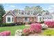 Charming brick home with blooming azaleas, lush lawn, and inviting curb appeal at 4086 Norton Se Pl, Smyrna, GA 30082