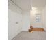 Hallway featuring a pair of closet doors, hardwood floors, and an exterior door for easy access at 4086 Norton Se Pl, Smyrna, GA 30082