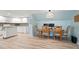 Open concept kitchen and dining area with modern white cabinets and stainless appliances at 4086 Norton Se Pl, Smyrna, GA 30082