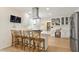 Bright, open kitchen featuring stainless steel appliances, an island with bar seating, and a separate workstation at 4086 Norton Se Pl, Smyrna, GA 30082