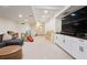 Spacious playroom with white cabinets, tv, furniture, and soft carpet flooring at 4086 Norton Se Pl, Smyrna, GA 30082