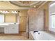 Bathroom featuring double vanities, tile shower, garden tub, and tile flooring at 4095 Boles Creek Dr, Duluth, GA 30096