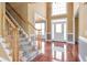 Foyer with hardwood floors, staircase, and natural light coming through the front door at 4095 Boles Creek Dr, Duluth, GA 30096