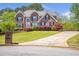 Charming two-story home with a landscaped yard and brick exterior at 4095 Boles Creek Dr, Duluth, GA 30096