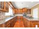 Well-equipped kitchen featuring stainless appliances, granite counters and a central island with cooktop at 4095 Boles Creek Dr, Duluth, GA 30096