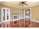 Cozy living room with fireplace, hardwood floors and access to a wet bar at 4095 Boles Creek Dr, Duluth, GA 30096
