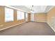 Bright living room features multiple windows and a neutral color palette at 4095 Boles Creek Dr, Duluth, GA 30096