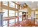 Spacious living room with large windows, fireplace, hardwood floors, and vaulted ceilings at 4095 Boles Creek Dr, Duluth, GA 30096