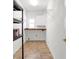Functional storage room with shelving, wooden countertop and durable tile floors at 4095 Boles Creek Dr, Duluth, GA 30096