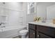 Bathroom featuring a white tub and dark vanity at 75 Glen Abbey Cir, Fairburn, GA 30213