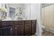 Double vanity bathroom featuring dark cabinets and modern fixtures at 75 Glen Abbey Cir, Fairburn, GA 30213