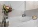 Bright bathroom featuring a soaking tub with tile surround and decorative accents at 75 Glen Abbey Cir, Fairburn, GA 30213