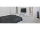 This bedroom features neutral walls, carpet, and a TV at 75 Glen Abbey Cir, Fairburn, GA 30213