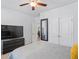 A spacious bedroom with a ceiling fan and large closets at 75 Glen Abbey Cir, Fairburn, GA 30213