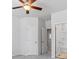 Bedroom featuring a ceiling fan, closet, and bathroom at 75 Glen Abbey Cir, Fairburn, GA 30213