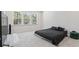 Bright bedroom with large window and hardwood floors at 75 Glen Abbey Cir, Fairburn, GA 30213