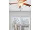 A wooden ceiling fan is installed against a white ceiling at 75 Glen Abbey Cir, Fairburn, GA 30213