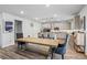 Spacious dining area adjacent to a modern kitchen, featuring stylish furnishings and ample natural light at 75 Glen Abbey Cir, Fairburn, GA 30213