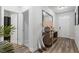 Bright foyer with hardwood floors, stylish console table, and decorative mirrors for a welcoming entrance at 75 Glen Abbey Cir, Fairburn, GA 30213