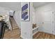 Bright foyer featuring hardwood floors, staircase, and decorative accents, creating a welcoming entrance at 75 Glen Abbey Cir, Fairburn, GA 30213