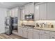 Modern kitchen with stainless steel appliances and granite countertops at 75 Glen Abbey Cir, Fairburn, GA 30213