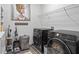 Well-lit laundry room featuring modern washer and dryer, complemented by stylish decor at 75 Glen Abbey Cir, Fairburn, GA 30213