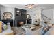 Cozy living room featuring a fireplace, comfortable seating, and stylish decor, ideal for entertaining guests at 75 Glen Abbey Cir, Fairburn, GA 30213