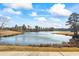 Scenic view of a serene pond, enhancing the community's natural beauty and appeal at 75 Glen Abbey Cir, Fairburn, GA 30213
