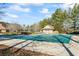 Community pool covered for the off-season, adjacent to a cabana, ready for summer fun at 75 Glen Abbey Cir, Fairburn, GA 30213