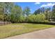View of the backyard with a fire pit perfect for outdoor entertaining in a fully fenced space at 774 Mary Ann Ne Dr, Marietta, GA 30068