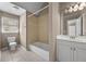 Bathroom with tub, tiled shower, white vanity, and ceramic tile floor at 774 Mary Ann Ne Dr, Marietta, GA 30068