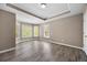 Bright bedroom with wood flooring, tray ceiling, and plentiful windows at 774 Mary Ann Ne Dr, Marietta, GA 30068