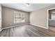 Light-filled bedroom with wood floors, neutral walls and natural light at 774 Mary Ann Ne Dr, Marietta, GA 30068