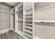 Organized walk-in closet with custom shelving at 774 Mary Ann Ne Dr, Marietta, GA 30068