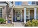 Charming front entrance featuring a decorative door and welcoming porch at 774 Mary Ann Ne Dr, Marietta, GA 30068