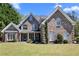 Charming brick home with well-manicured lawn and lush landscaping at 774 Mary Ann Ne Dr, Marietta, GA 30068