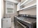 Well-equipped laundry room with stainless steel washer and dryer and utility sink at 774 Mary Ann Ne Dr, Marietta, GA 30068