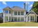 Stunning rear exterior with multiple windows allowing ample natural light and a chimney at 774 Mary Ann Ne Dr, Marietta, GA 30068