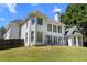 Beautiful rear exterior showcasing plenty of windows allowing natural light and a lovely yard at 774 Mary Ann Ne Dr, Marietta, GA 30068