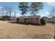 Cozy brick home with a tidy front yard and clear blue skies above at 8554 Taylor Rd, Riverdale, GA 30274