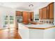 Bright kitchen with wooden cabinets, an island cooktop, and stainless steel appliances at 1065 Wylie Se St, Atlanta, GA 30316