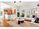 Open-concept living area with hardwood floors connecting the living room to the kitchen at 1065 Wylie Se St, Atlanta, GA 30316