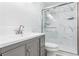 Bathroom featuring a marble-walled shower with glass doors and updated vanity at 133 Cross Gate Dr, Marietta, GA 30068