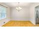 Bright dining room featuring wood floors and a modern chandelier at 133 Cross Gate Dr, Marietta, GA 30068