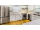 Modern kitchen featuring stainless steel appliances, white cabinets, and hardwood floors at 133 Cross Gate Dr, Marietta, GA 30068